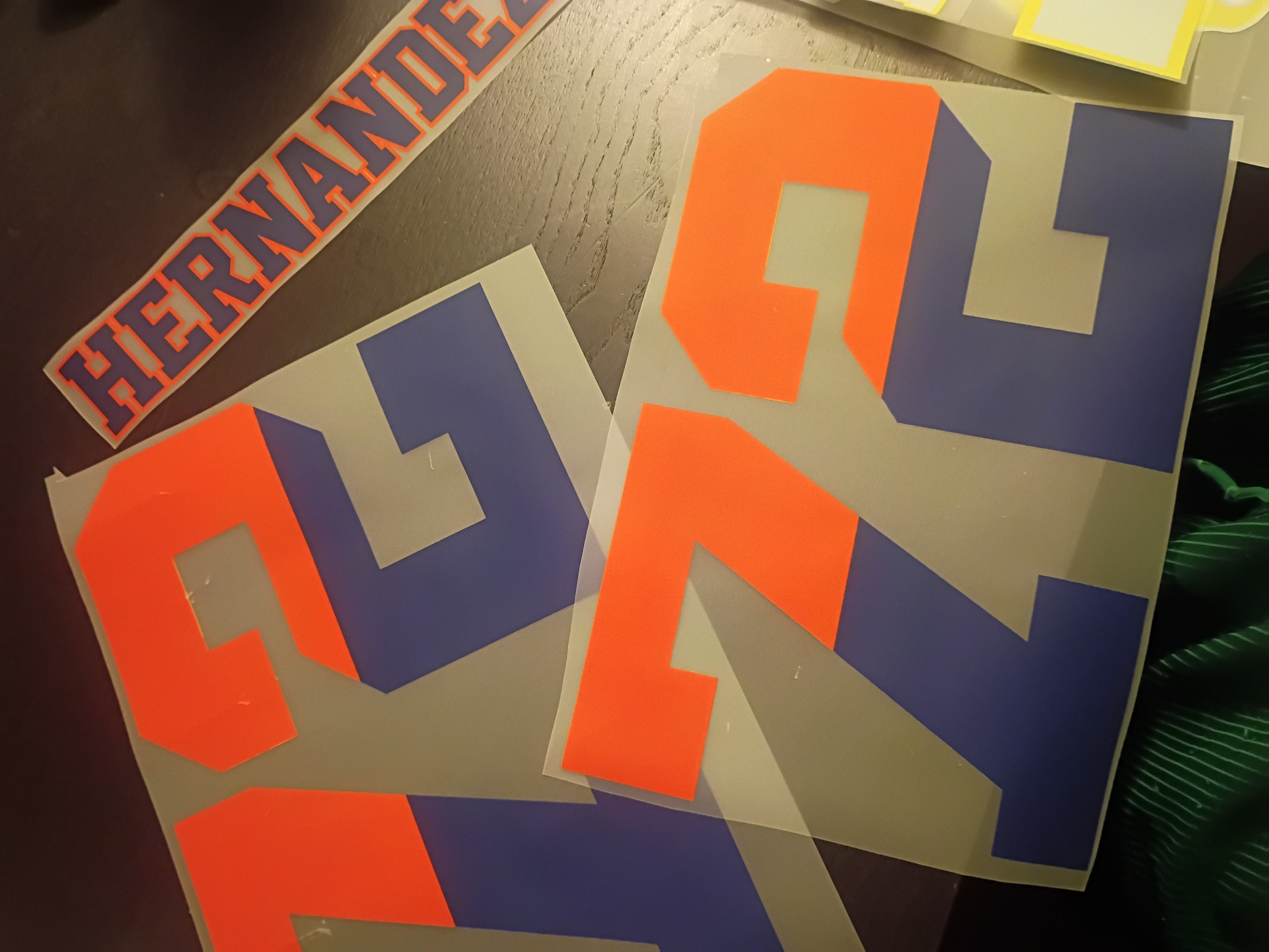 Orange and navy split-color number 72 jersey transfers and a matching Hernandez name print on backing sheets.